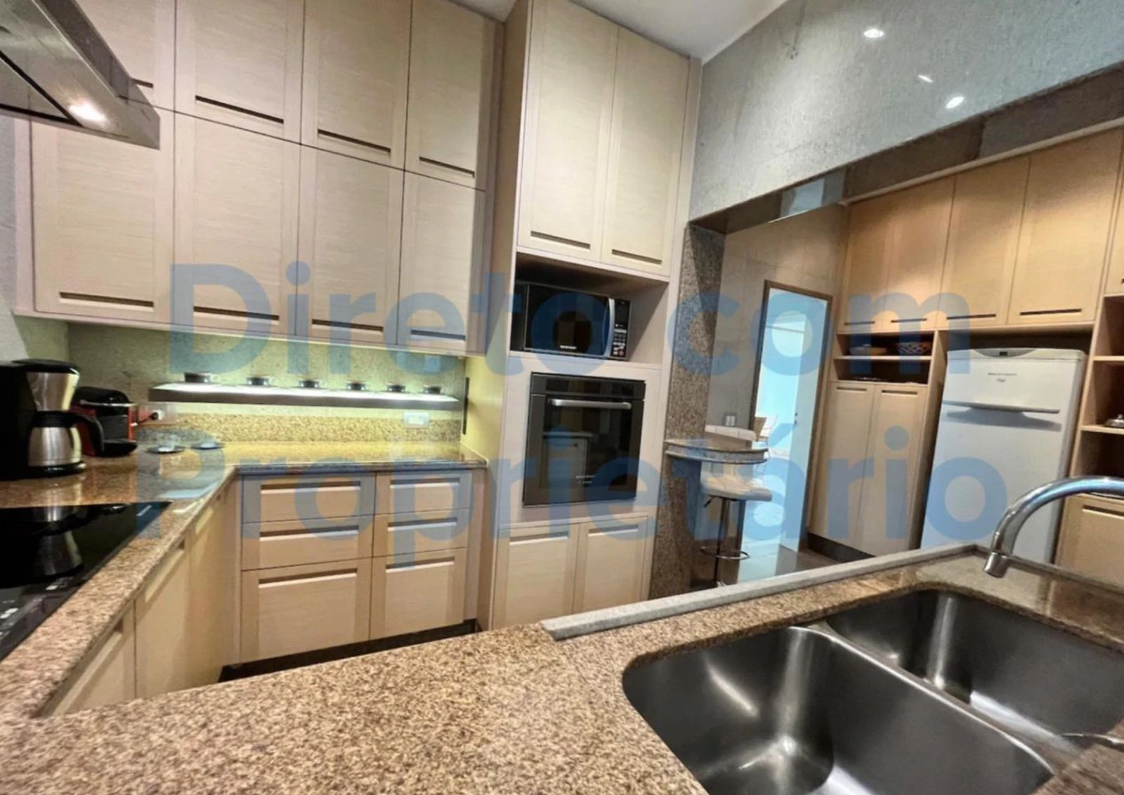 Apartment B Avenida Atlantica kitchen with stone counter and appliances