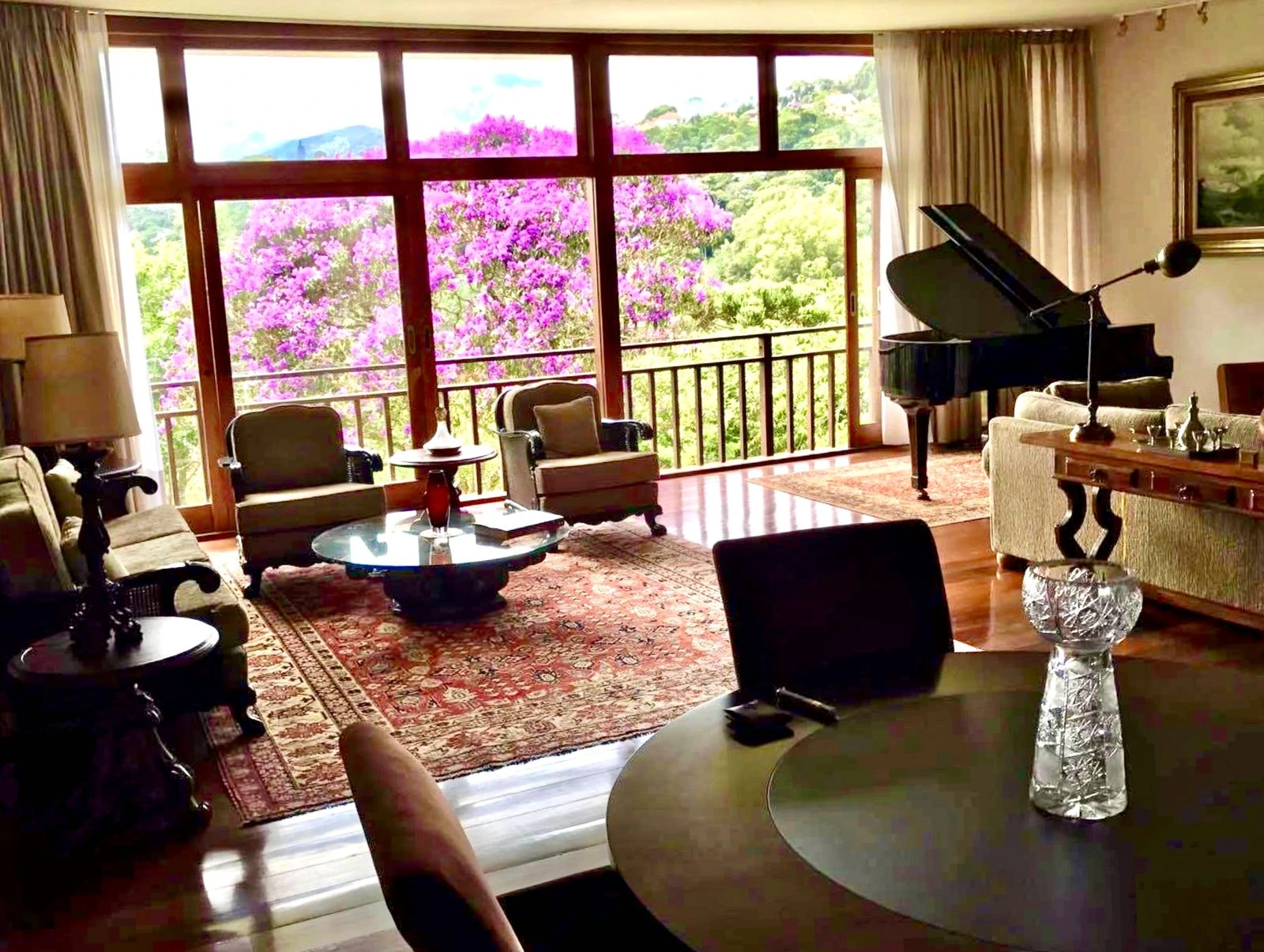 Teresopolis living room with piano and flowering mountain view