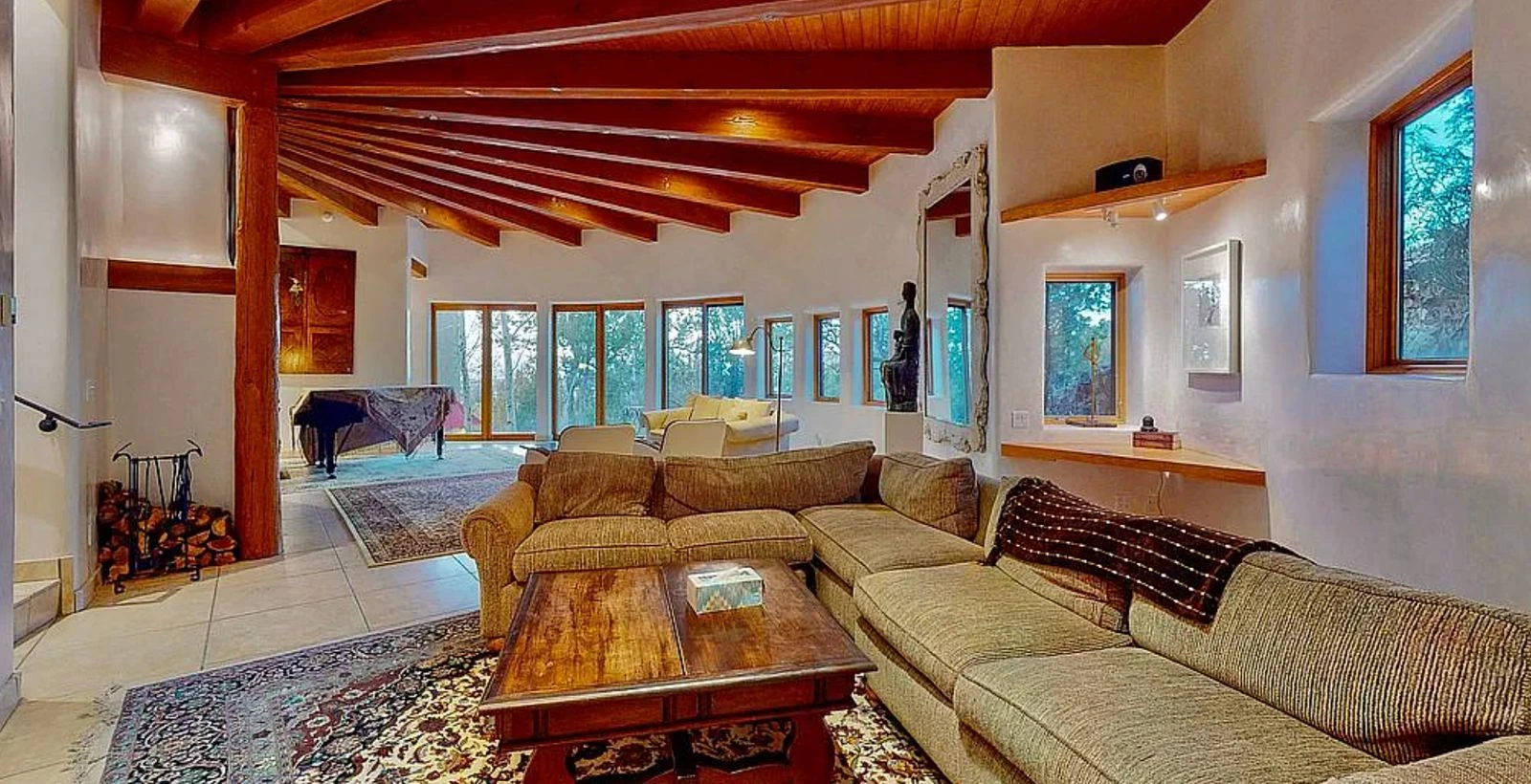 Santa Fe residence interior living room with wood beams and piano