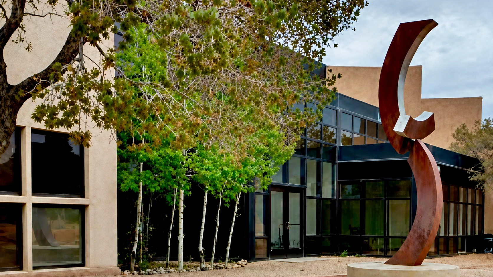 Red sculpture at Multedo Campus building exterior