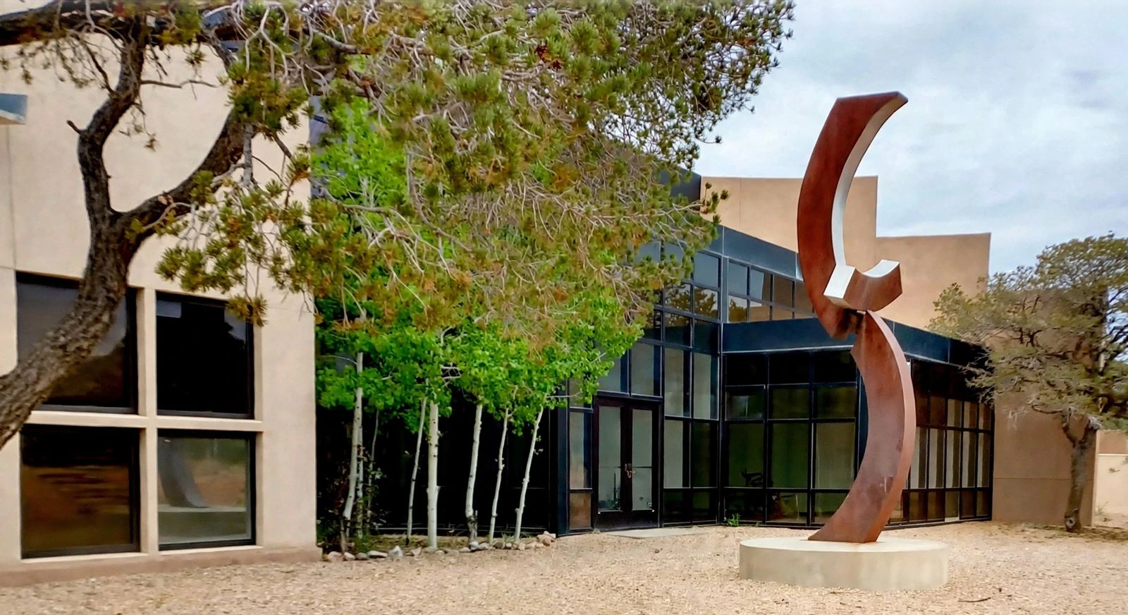 Red sculpture at Multedo Campus building exterior